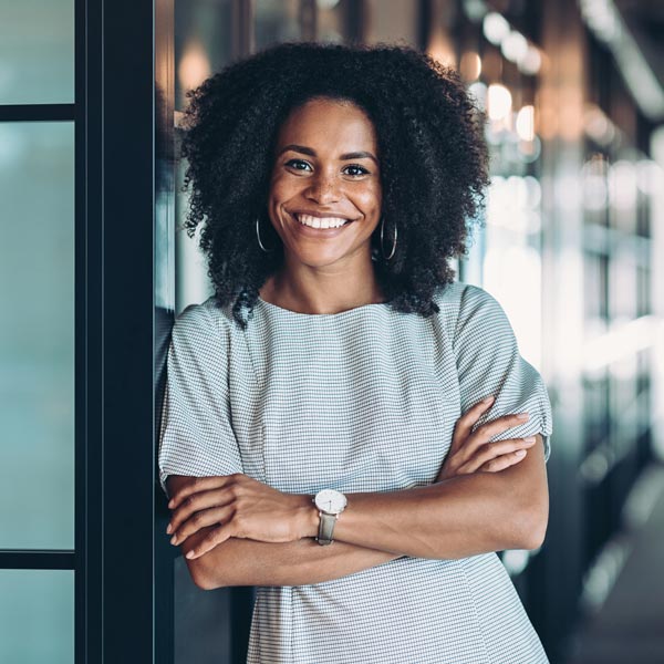 Smiling woman showcasing her bright smile after teeth whitening in Florence, KY & the Tri-State area