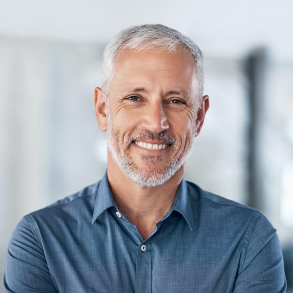 A man opted for dental crowns to protect damaged & weak teeth in Florence & the Tri-State area.