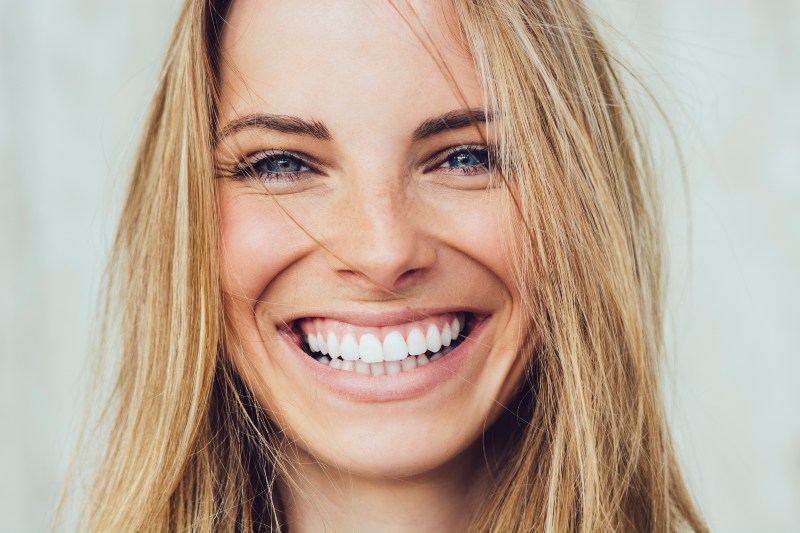 Woman happy with the results of tooth extraction procedure she had in Independence, KY